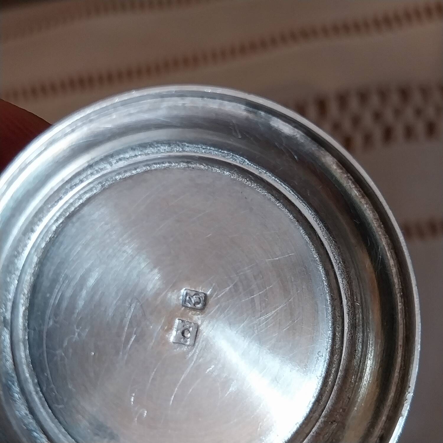 Egg cup and spoon in silver metal