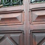 Porte d’entrée vitrée en chêne et grilles en fer, XIXème s.