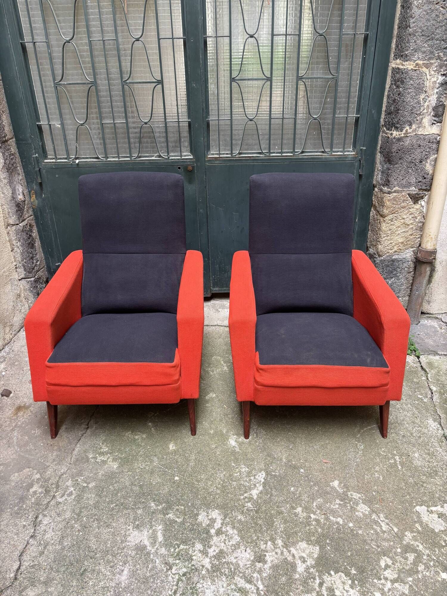 Pair of vintage black and red armchairs from the 1960s.