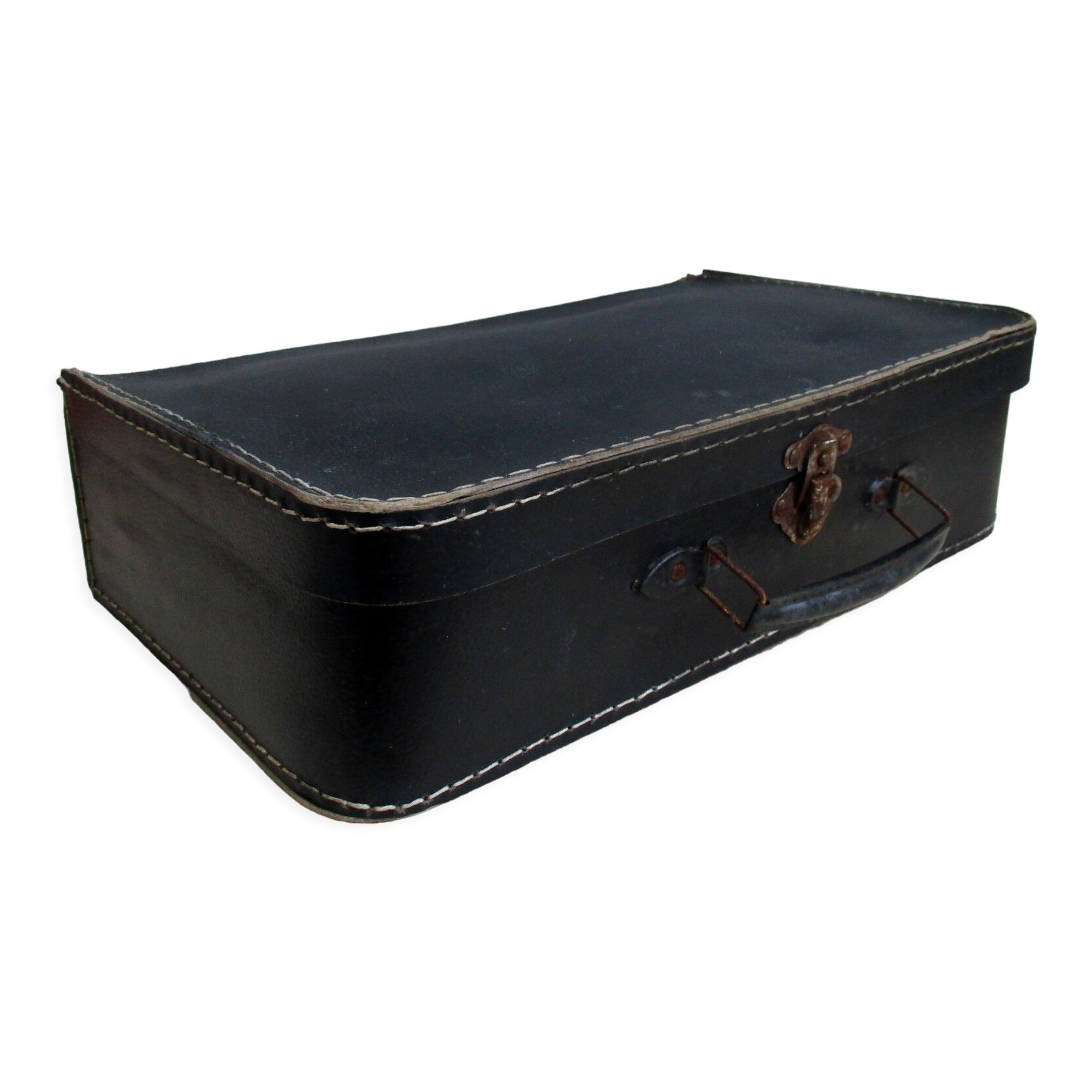 Small suitcase in old navy blue cardboard