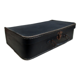 Small suitcase in old navy blue cardboard