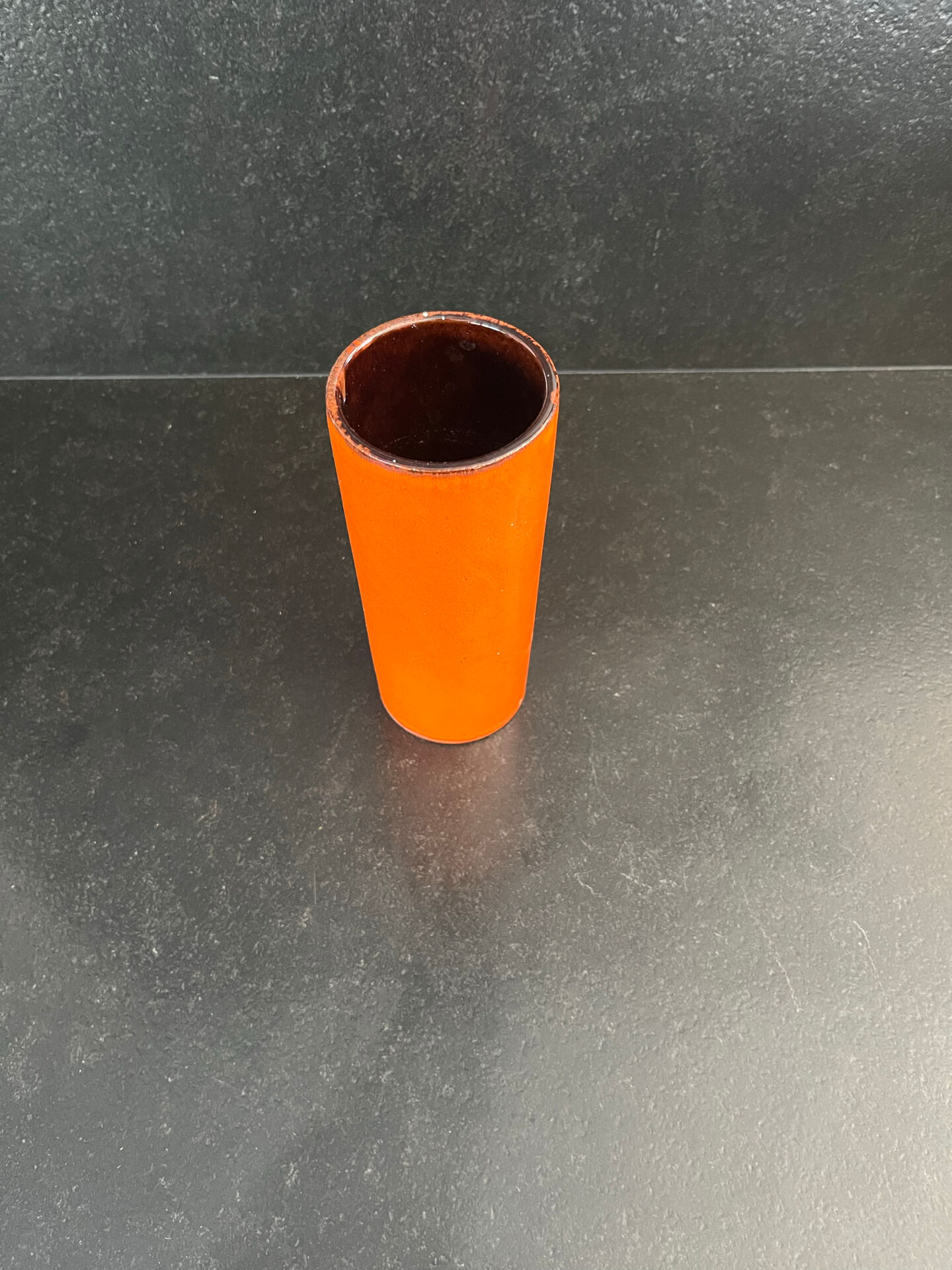 Orange glazed ceramic cylinder vase