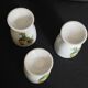 Porcelain egg cups with rooster decoration, set of three
