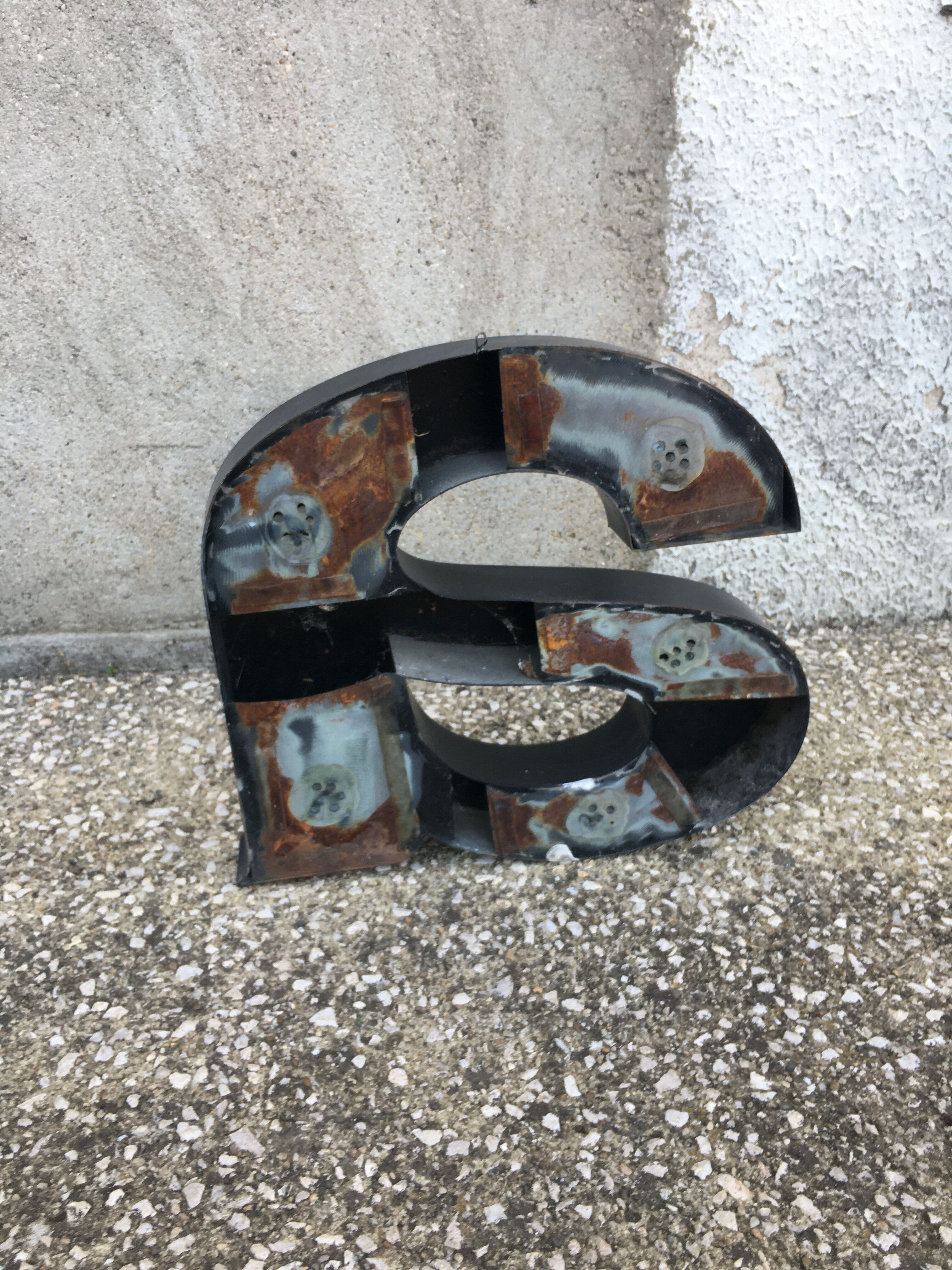Vintage metal sign letter