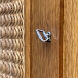 Rattan wardrobe and its compass-legged chest of drawers, 1960