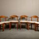 Henning Kjærnulf dining chairs set in Oak and Off White Bouclé, Denmark, 1960s