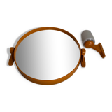 Tilting orange plastic mirror with its matching wall light