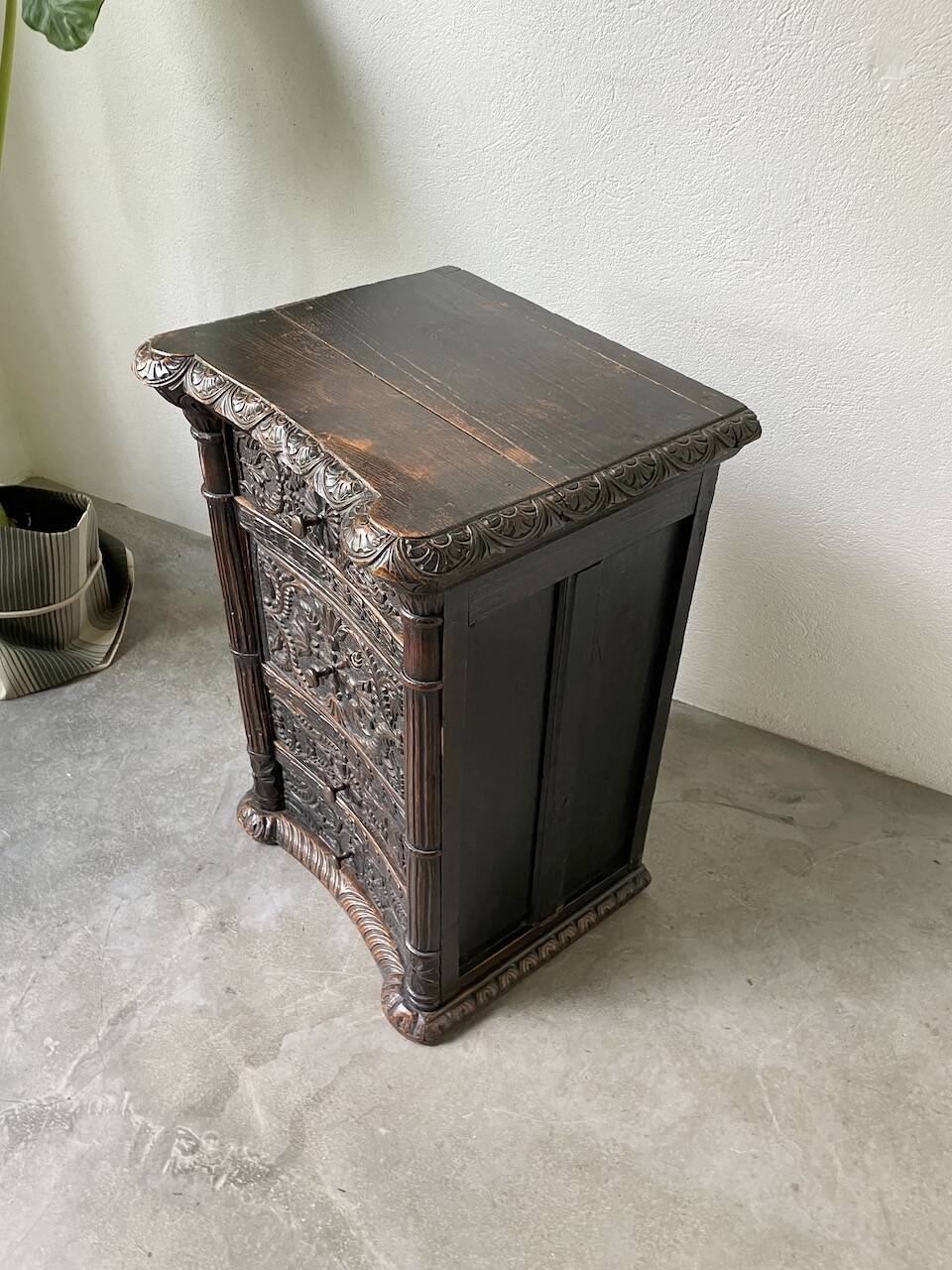 19th century chest of drawers in carved blackened pine
