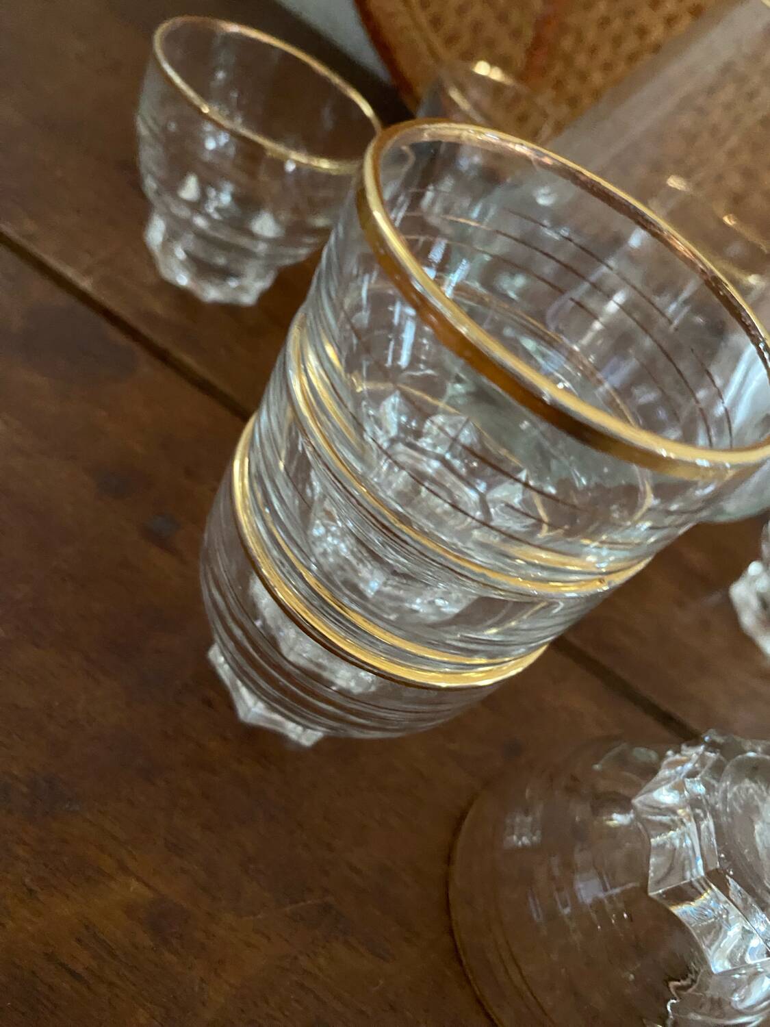 9 vintage gold rimmed glasses.