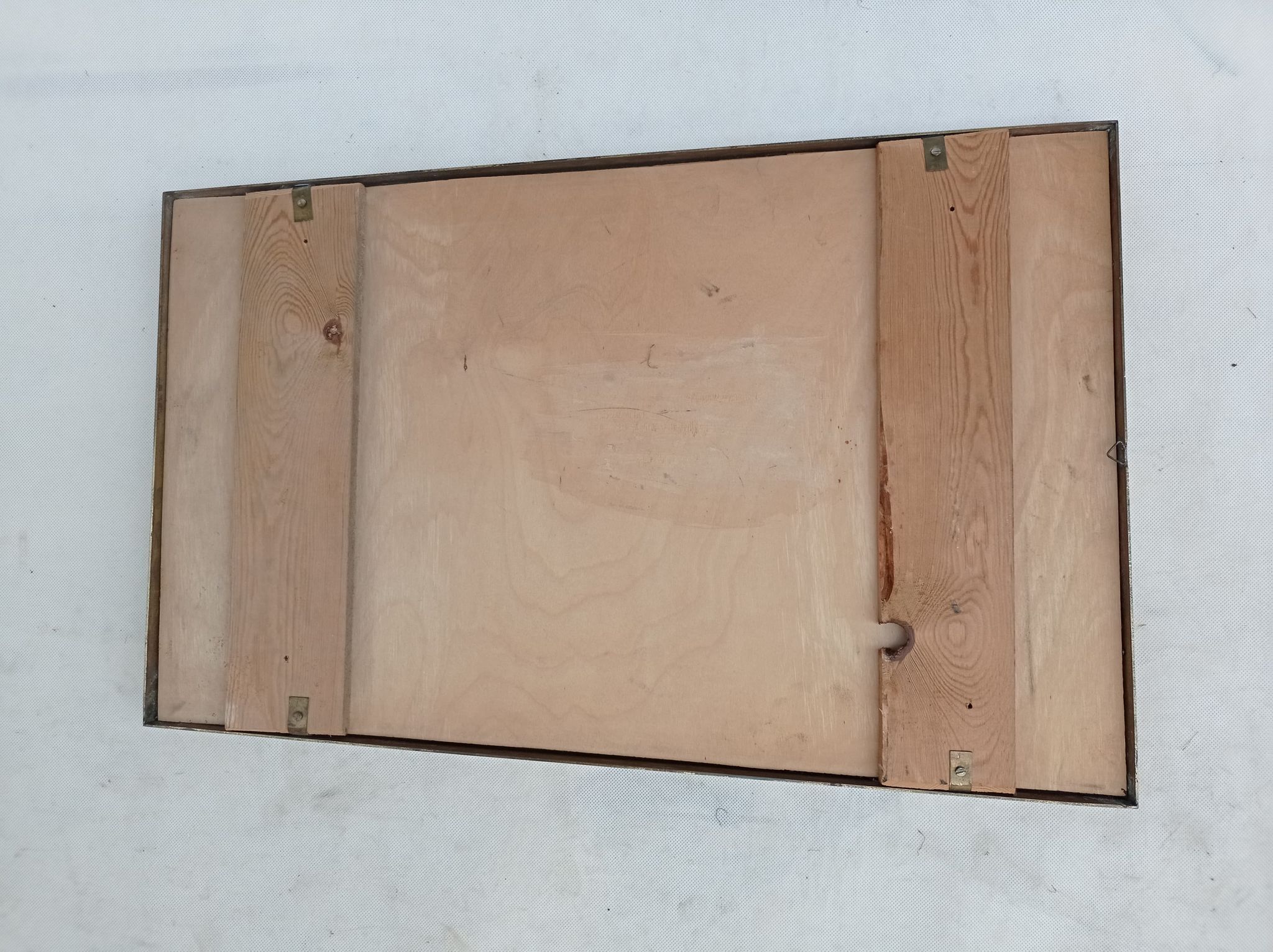 Mirror in a brass frame, dating back to the 1960s