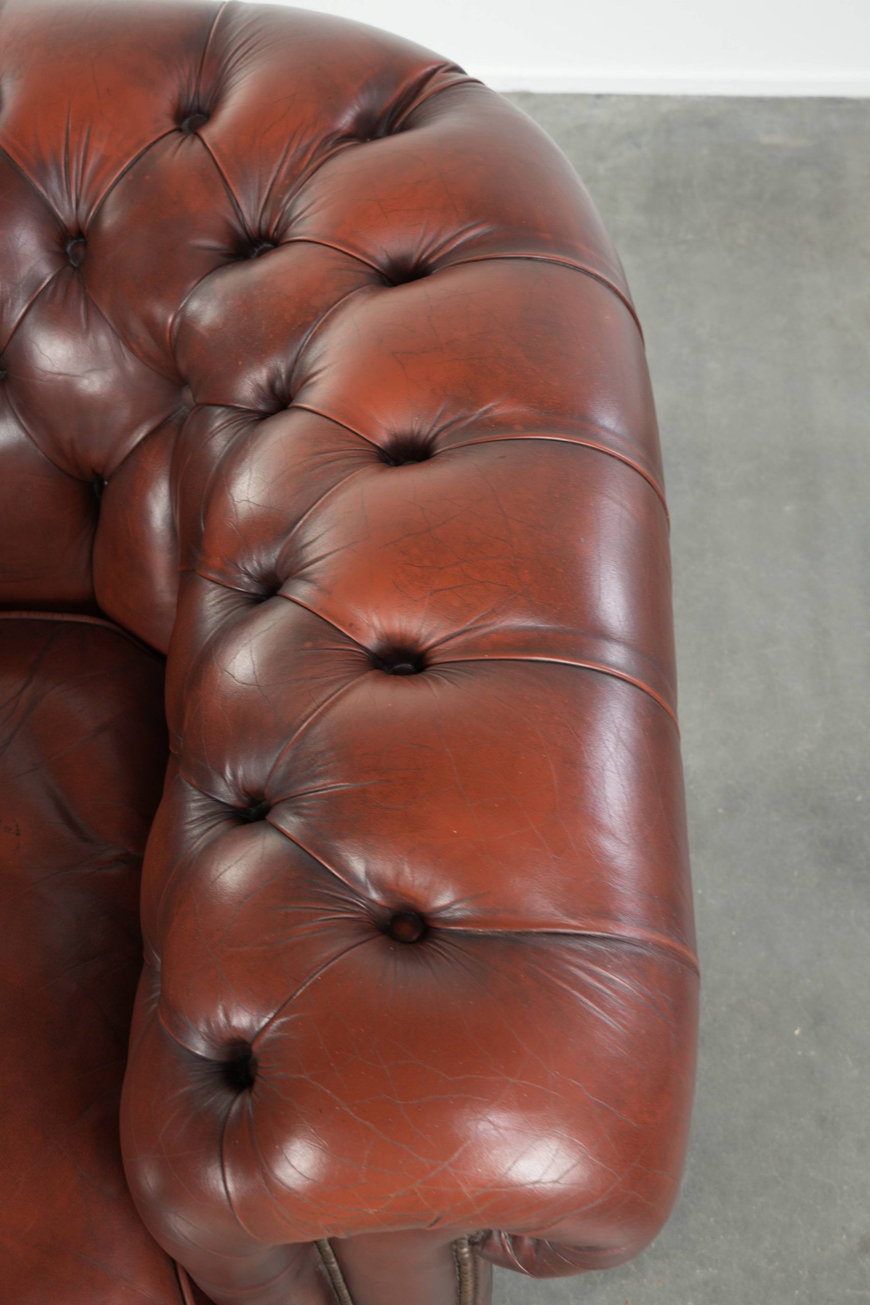 Cowhide Chesterfield armchair in a classic English style