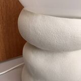 Large table lamp in off-white ceramic with an organic globe shape.