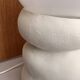 Large table lamp in off-white ceramic with an organic globe shape.