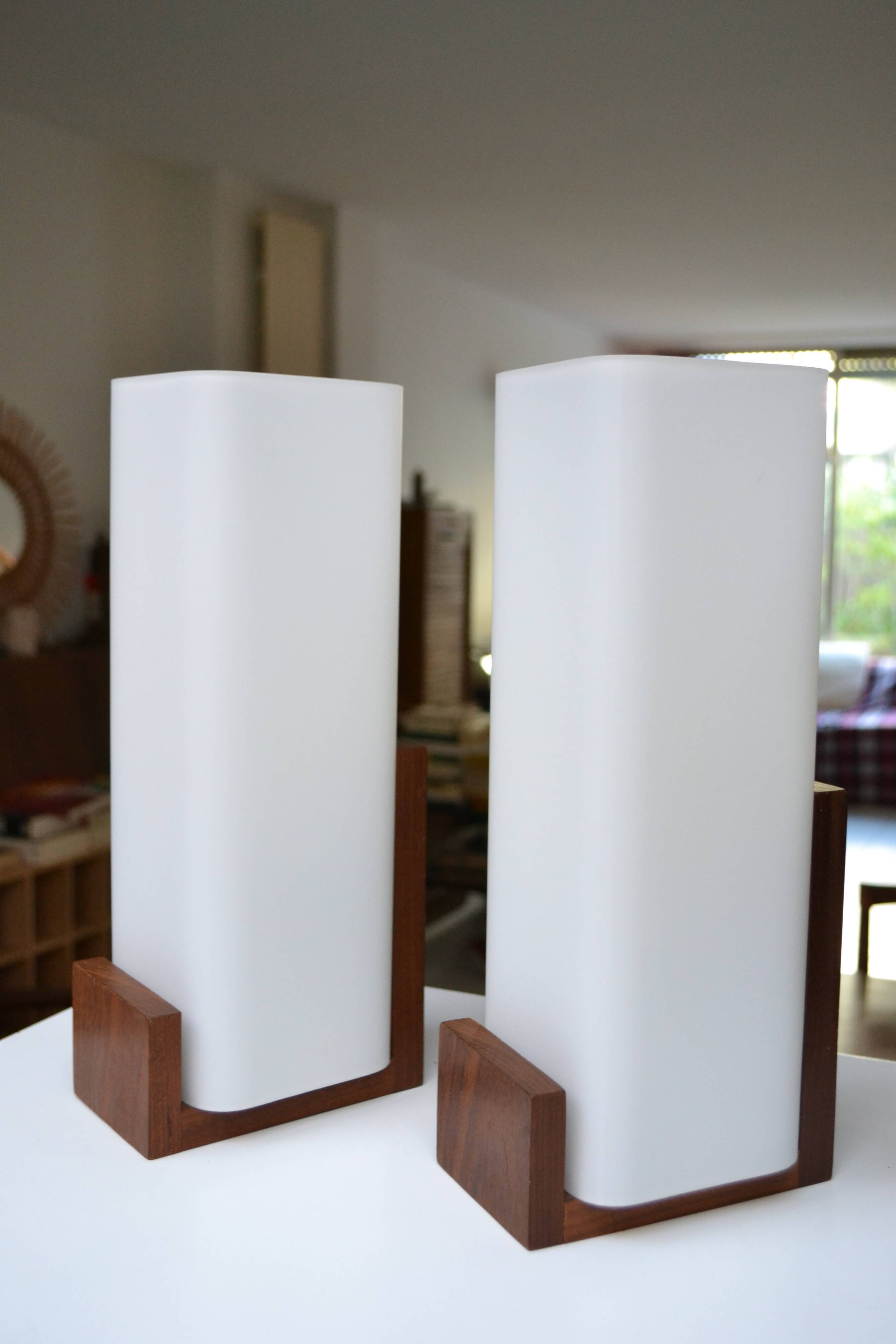 Pair of Louis Kalff opaline and teak wall lamps