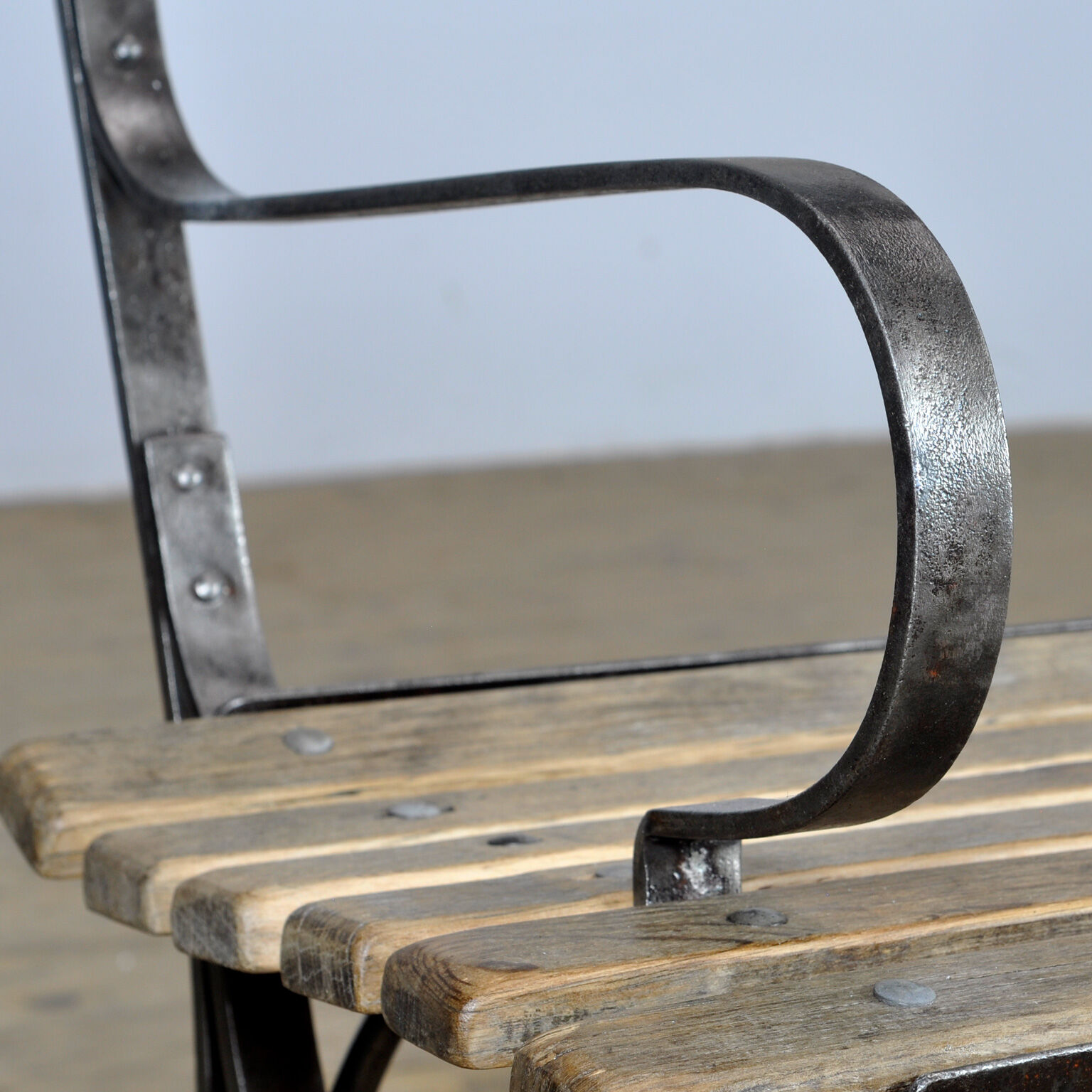 Riveted iron park bench 1920s