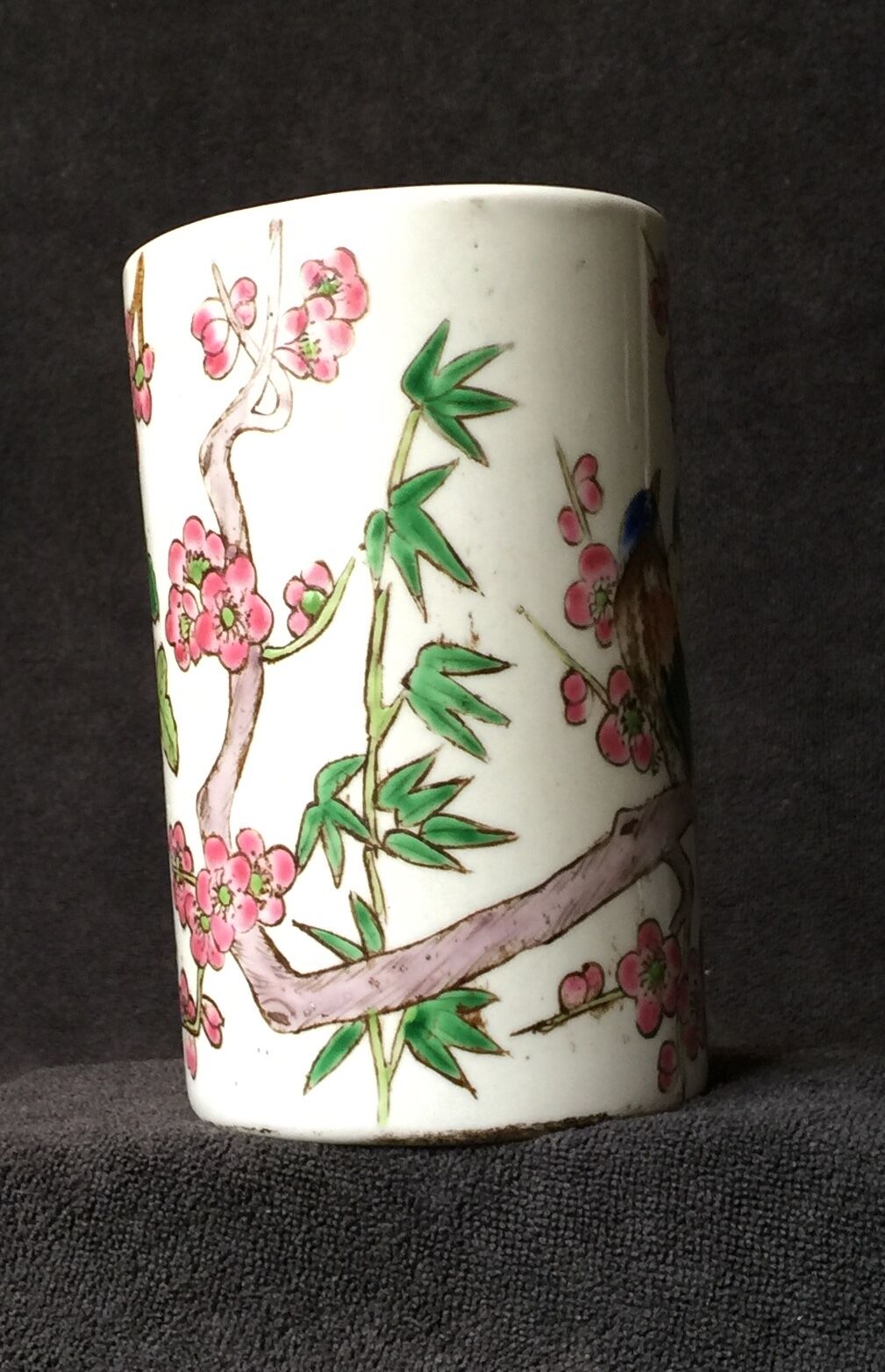 Small vase roll decoration birds branches of cherry blossoms and flowers