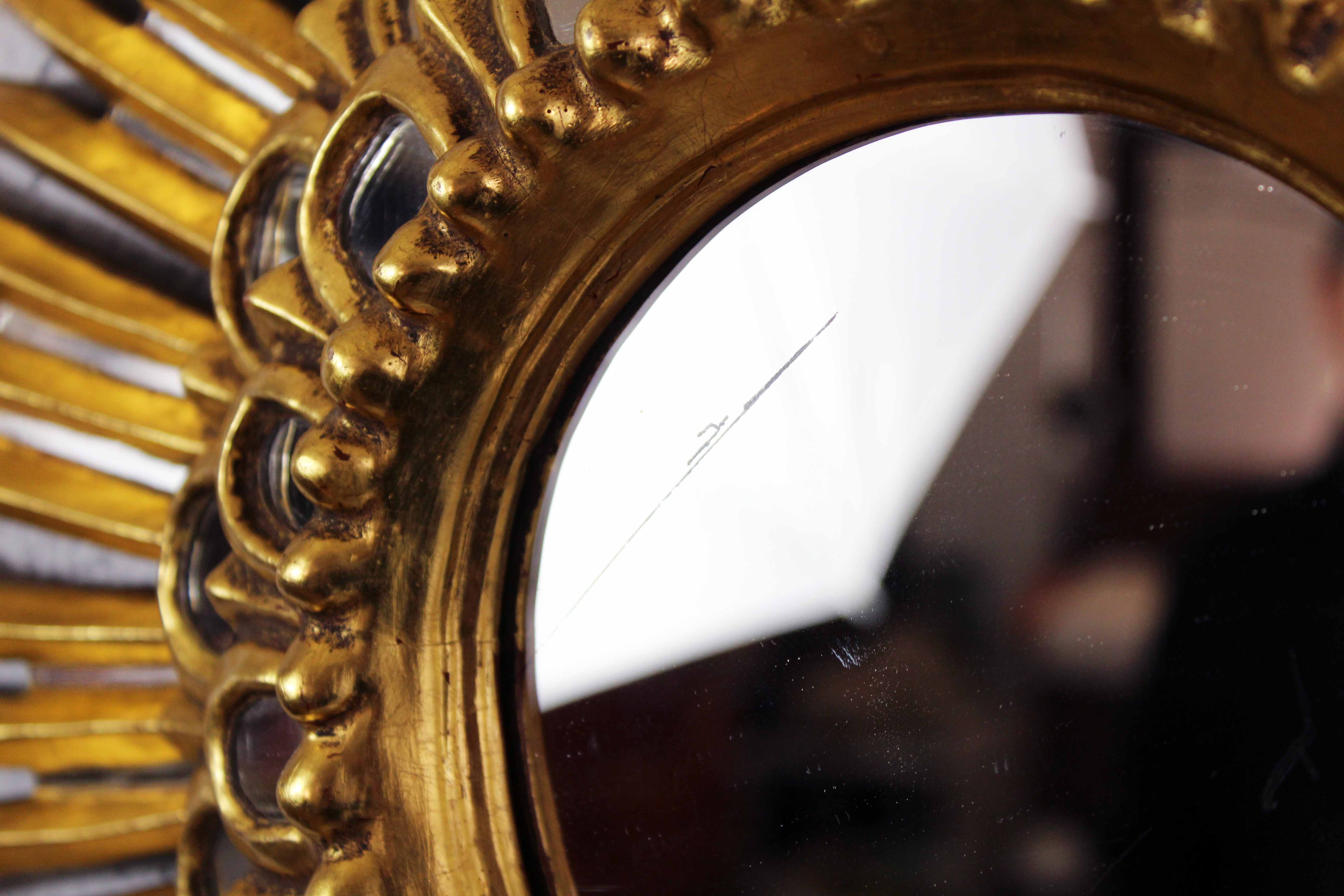 Sun mirror in wood and gilded stucco