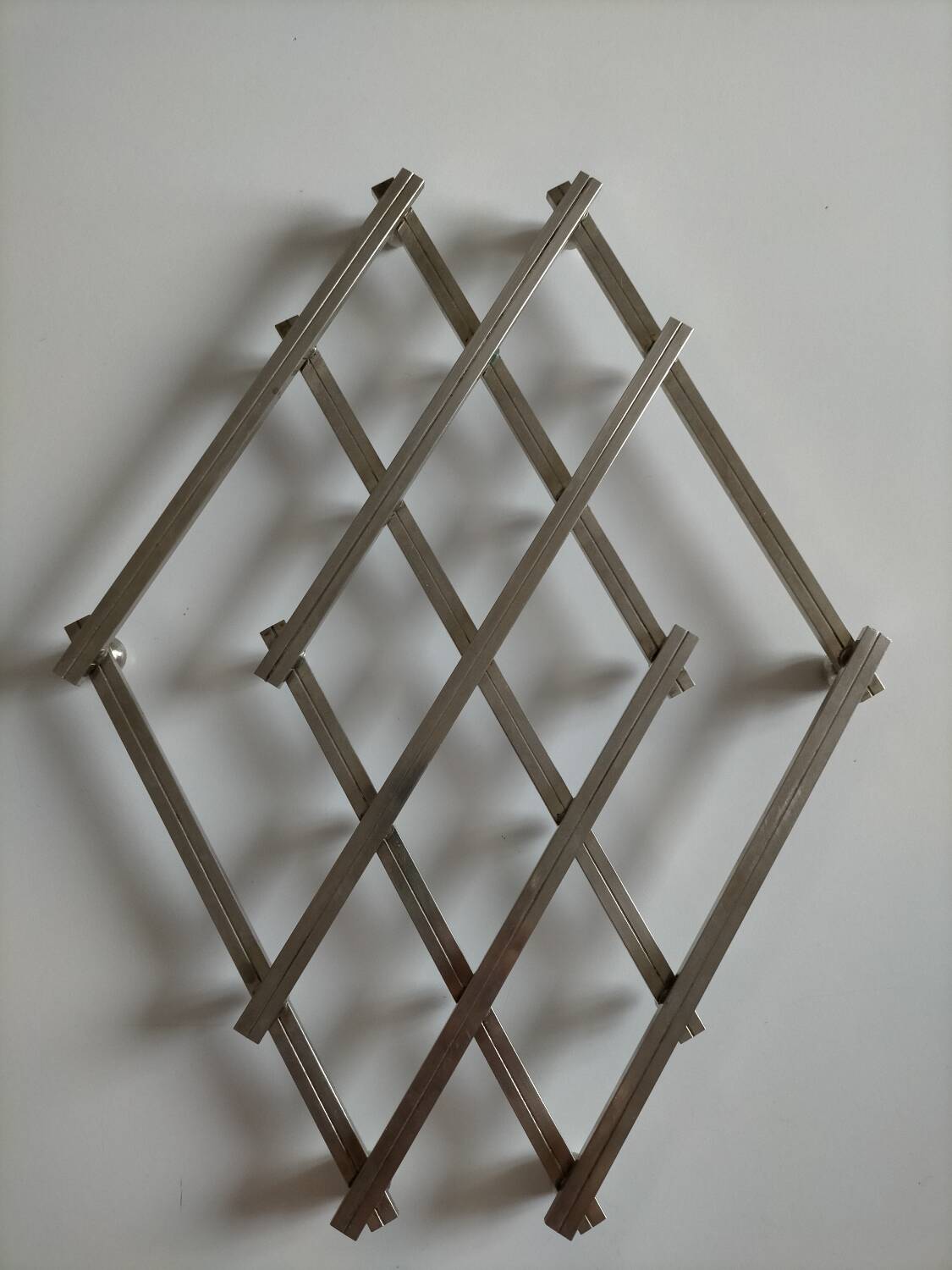 Jacques Adnet metal trivet in very good condition