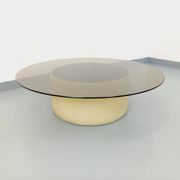 Vintage round coffee table in glass, leather, and metal in Space Age style from the 70s.