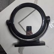 Vintage round pivoting mirror in black, retro style from the 70s/80s.