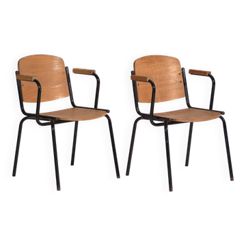 2 industrial-style chairs with armrests, circa 1950.