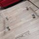 Design coffee table from Habitat in transparent plexiglass, mounted on wheels.