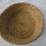 Trash has fruit in natural tied straw