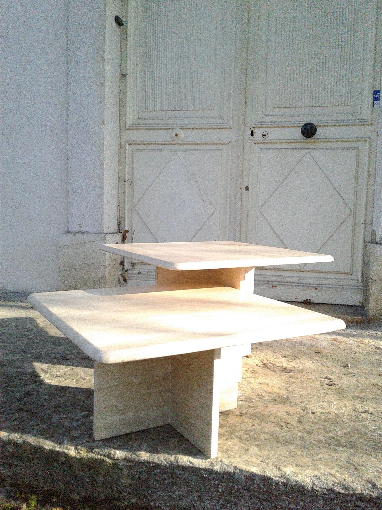 Two coffee tables giggle in travertine
