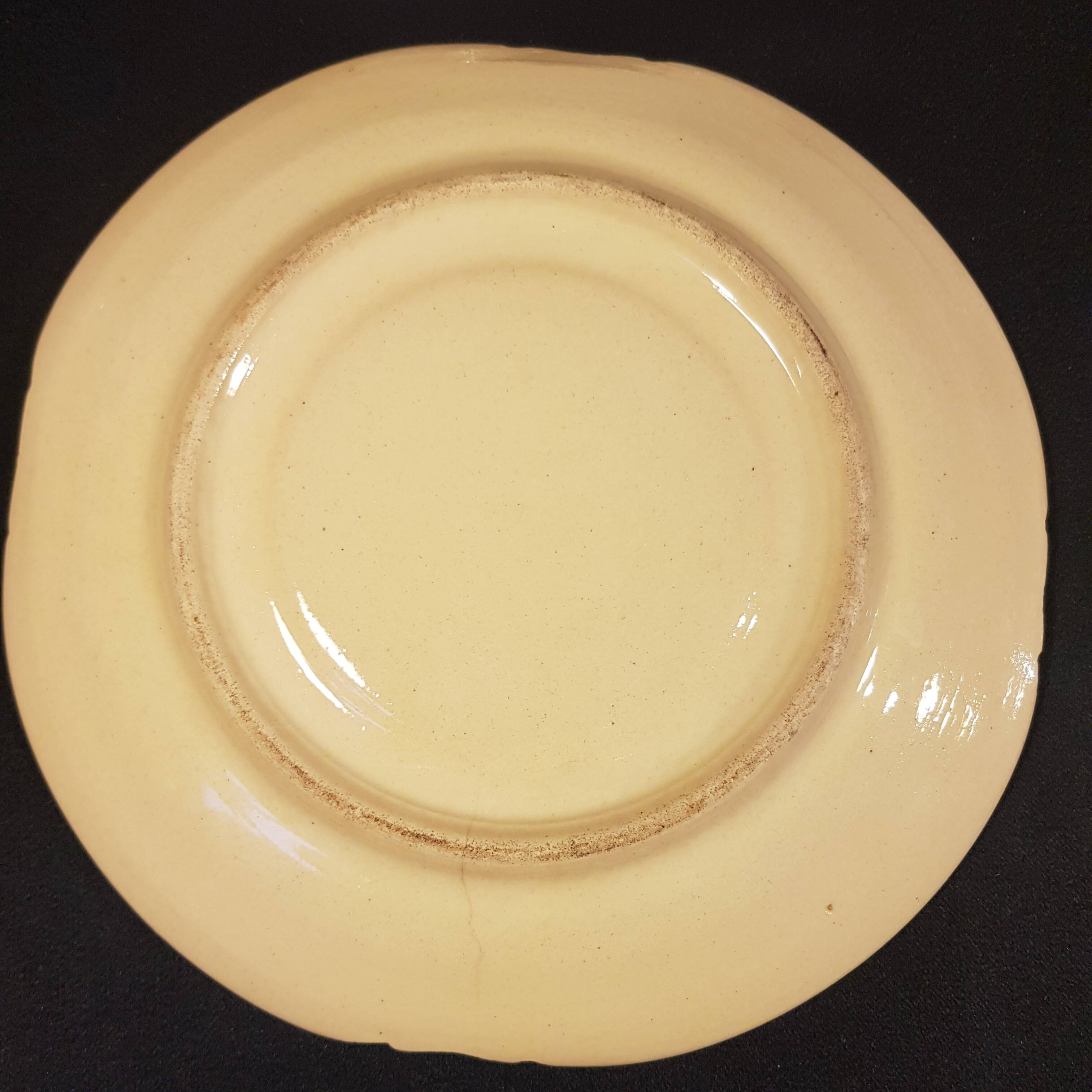 4 Quimper earthenware saucers or plates
