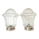 Pair of lantern-style ceiling lights or antique lamps.