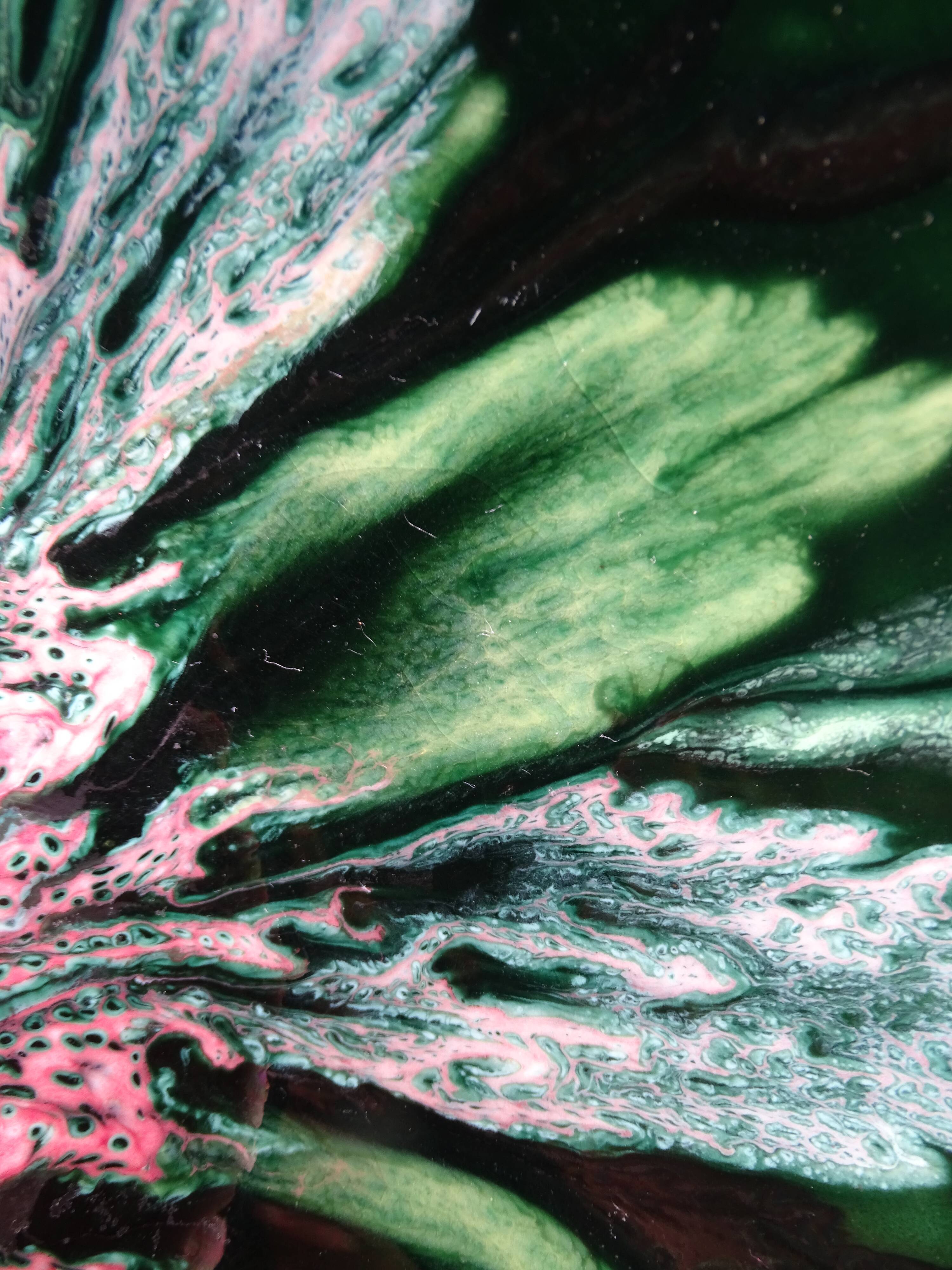 Green faience bowl decorated with multicolored drips around 1970