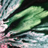 Green faience bowl decorated with multicolored drips around 1970