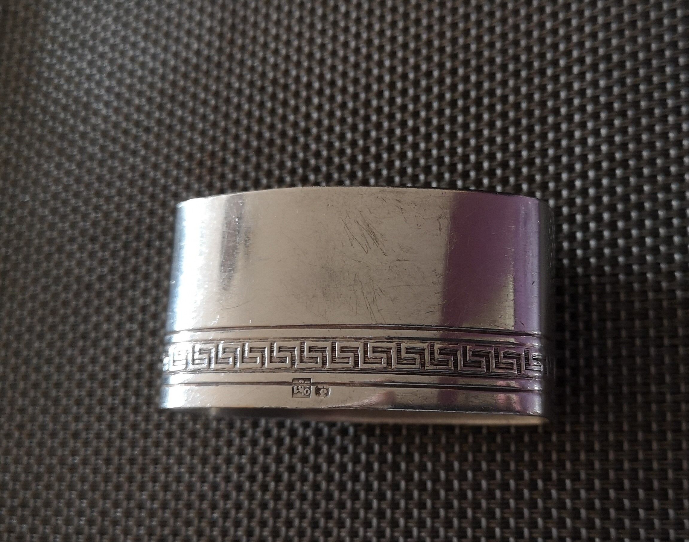Punched silver metal towel round