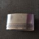 Punched silver metal towel round