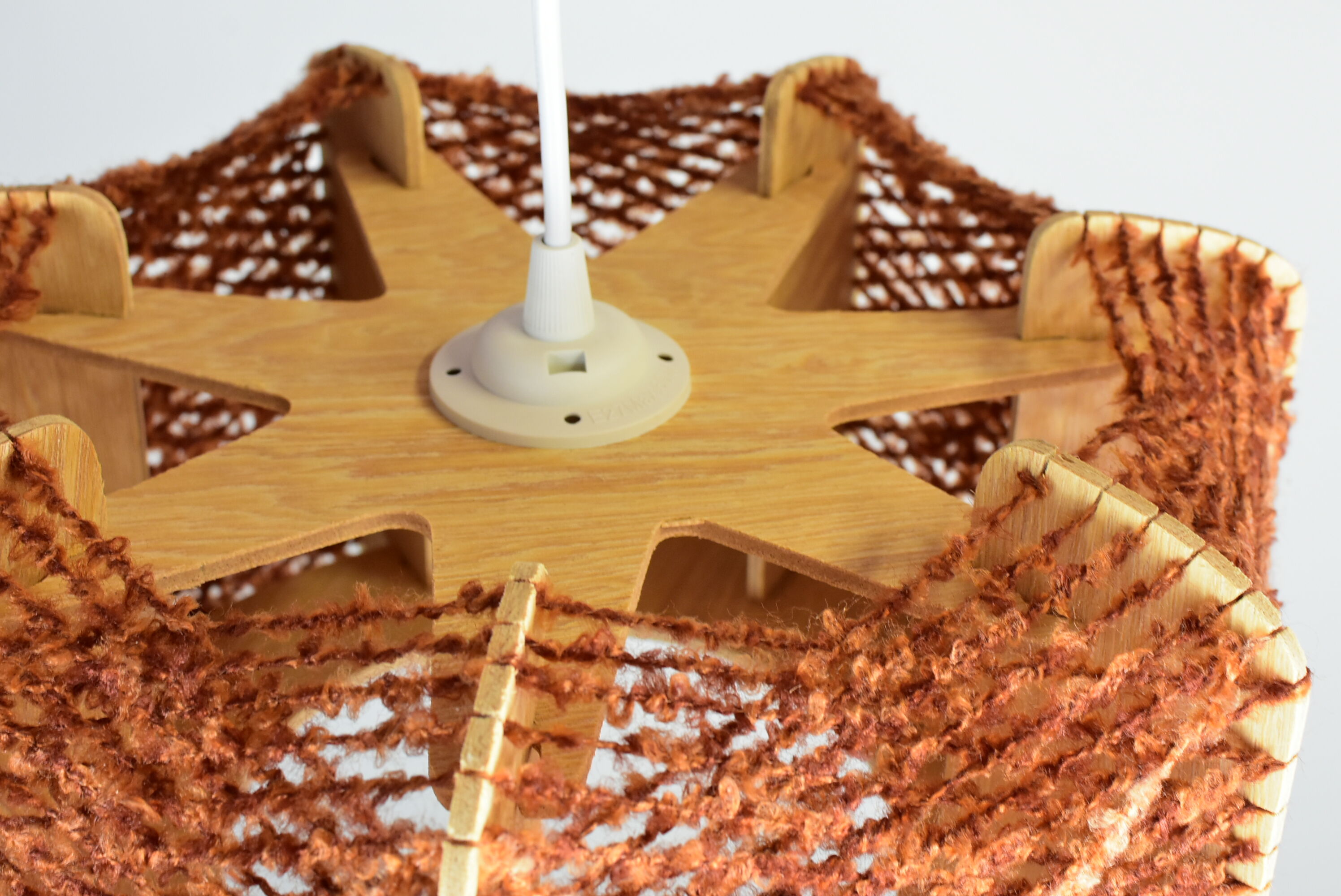 Brown wire and wood pendant light.