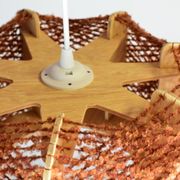 Brown wire and wood pendant light.
