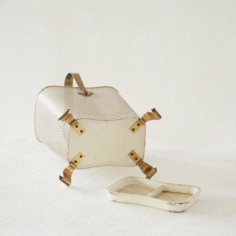 Mid-century umbrella stand in patinated brass and perforated metal, 1950s.