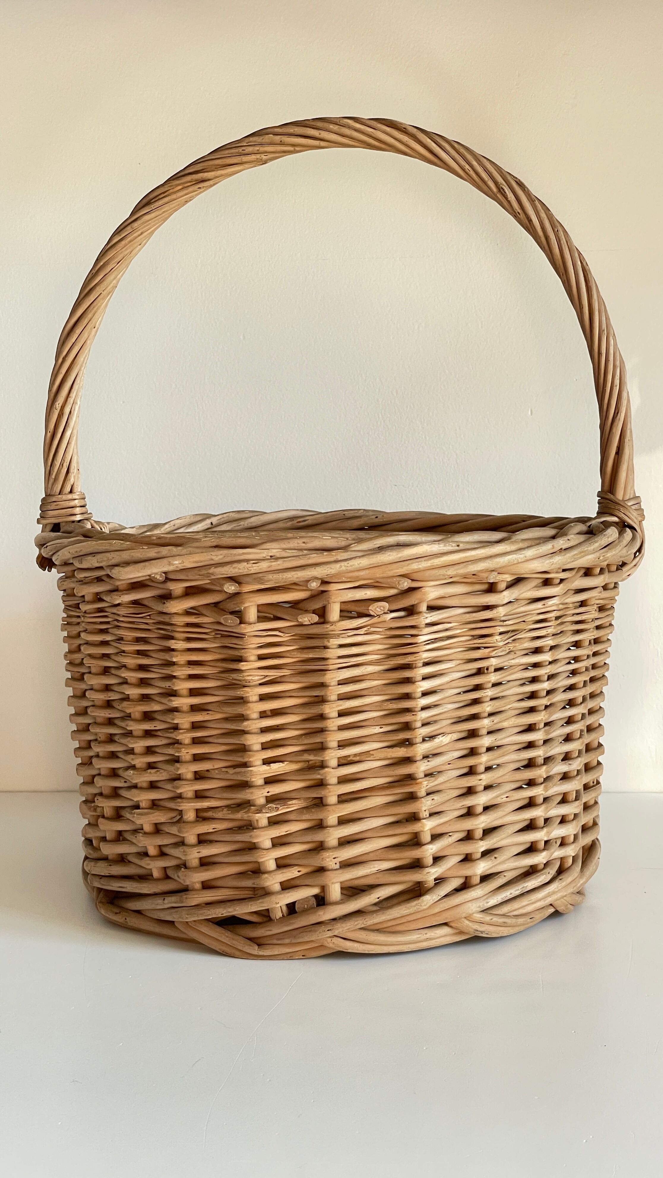 Basket with vintage rattan bottles