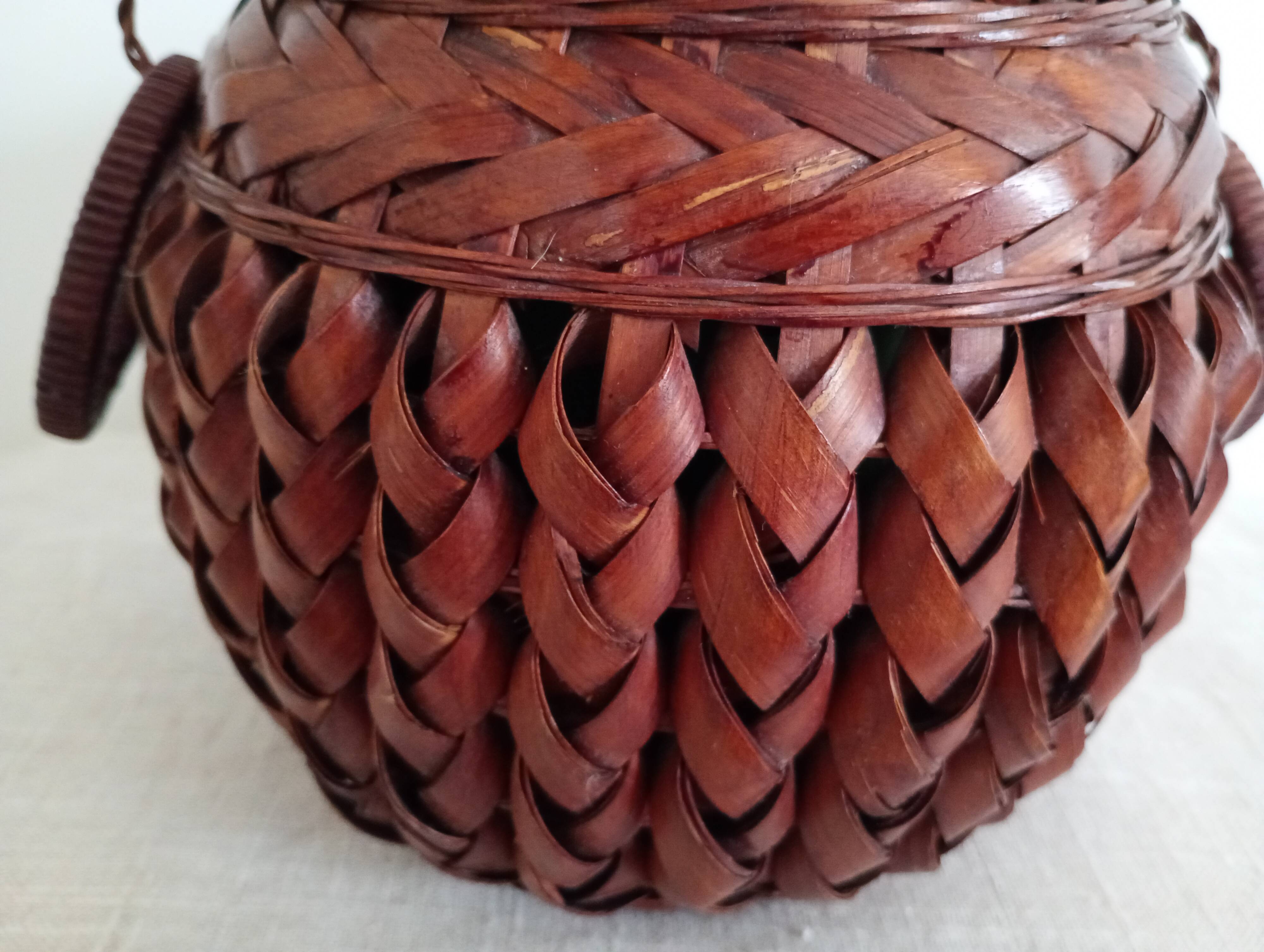 Japanese vase made of woven bamboo. Ikebana.