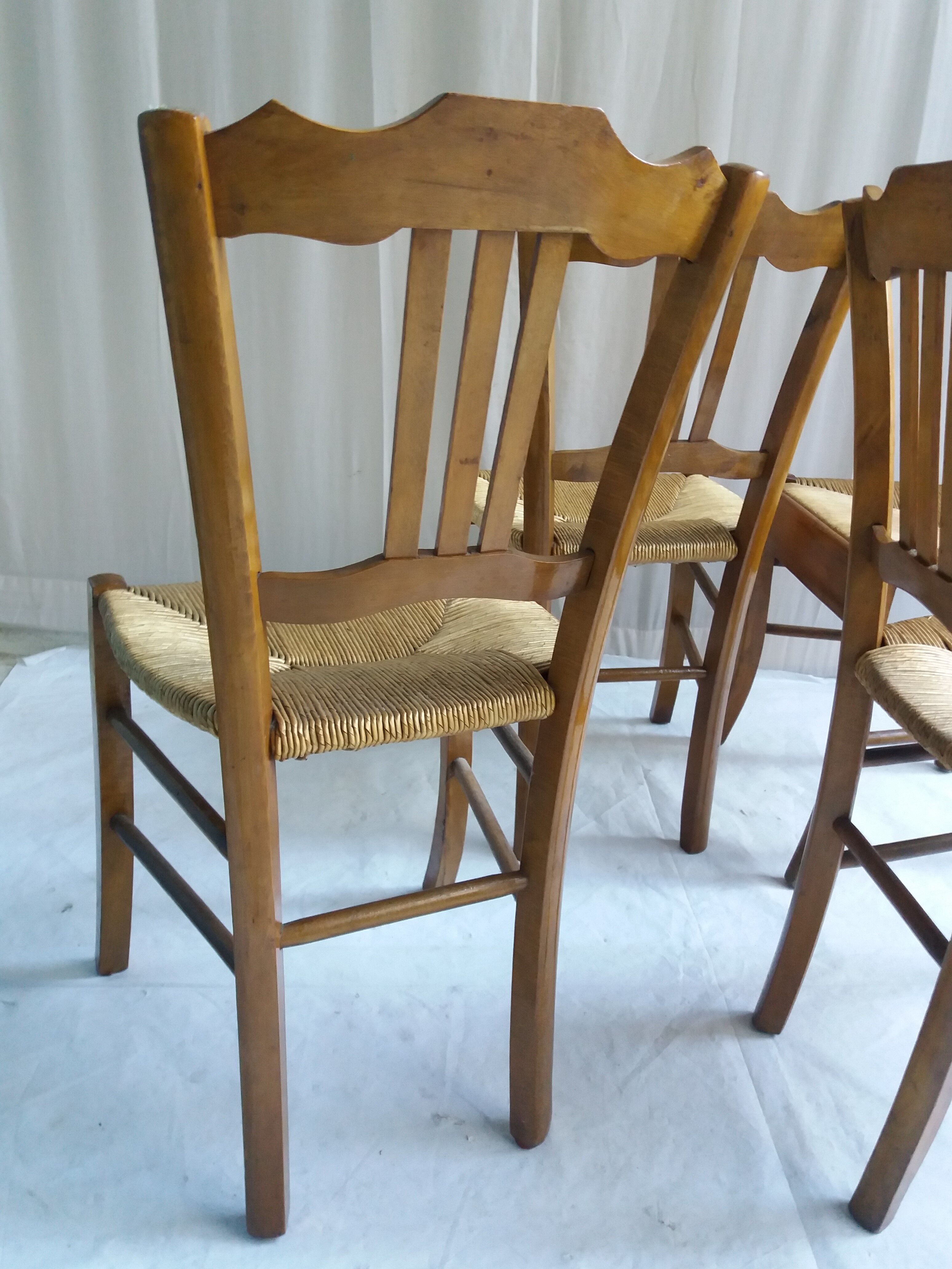 Series of 4 old mulched chairs
