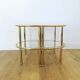 Pairs of gilded metal bedside tables and glass tops