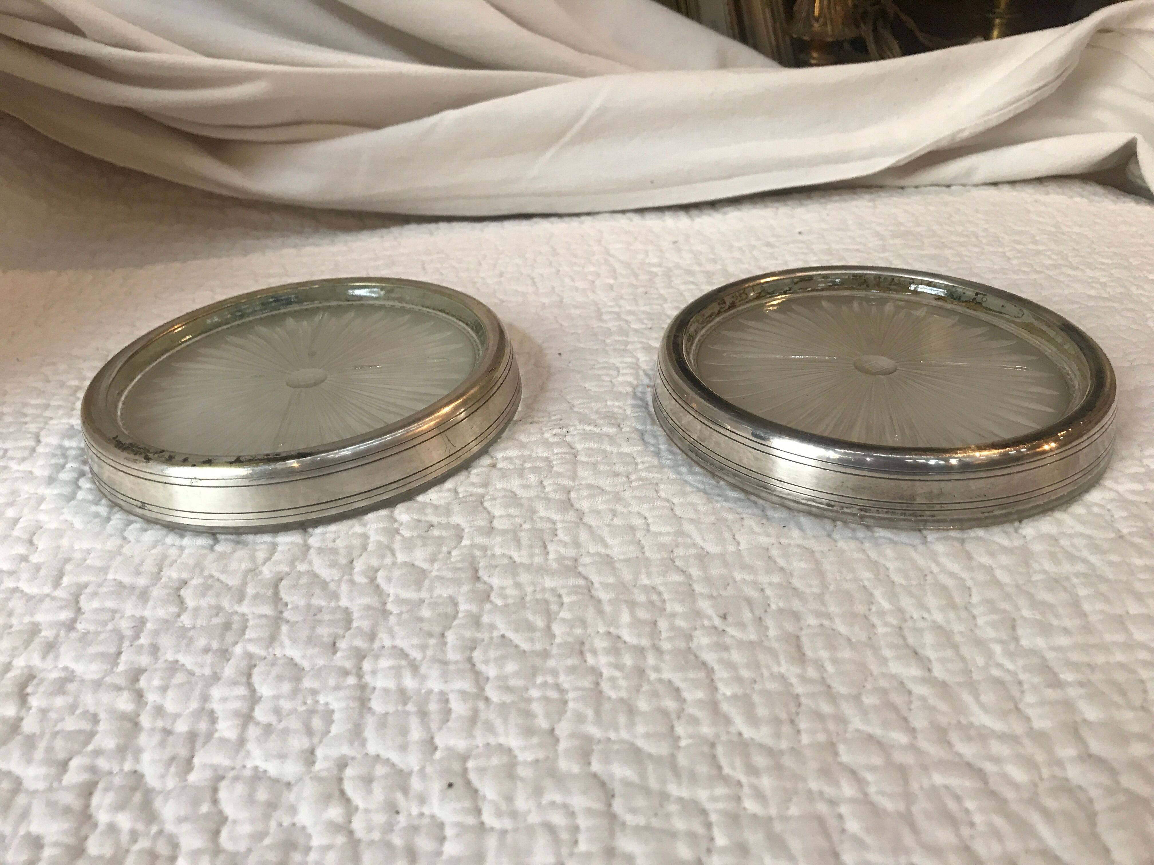 Pair of silver metal and glass bottle bottoms