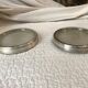 Pair of silver metal and glass bottle bottoms