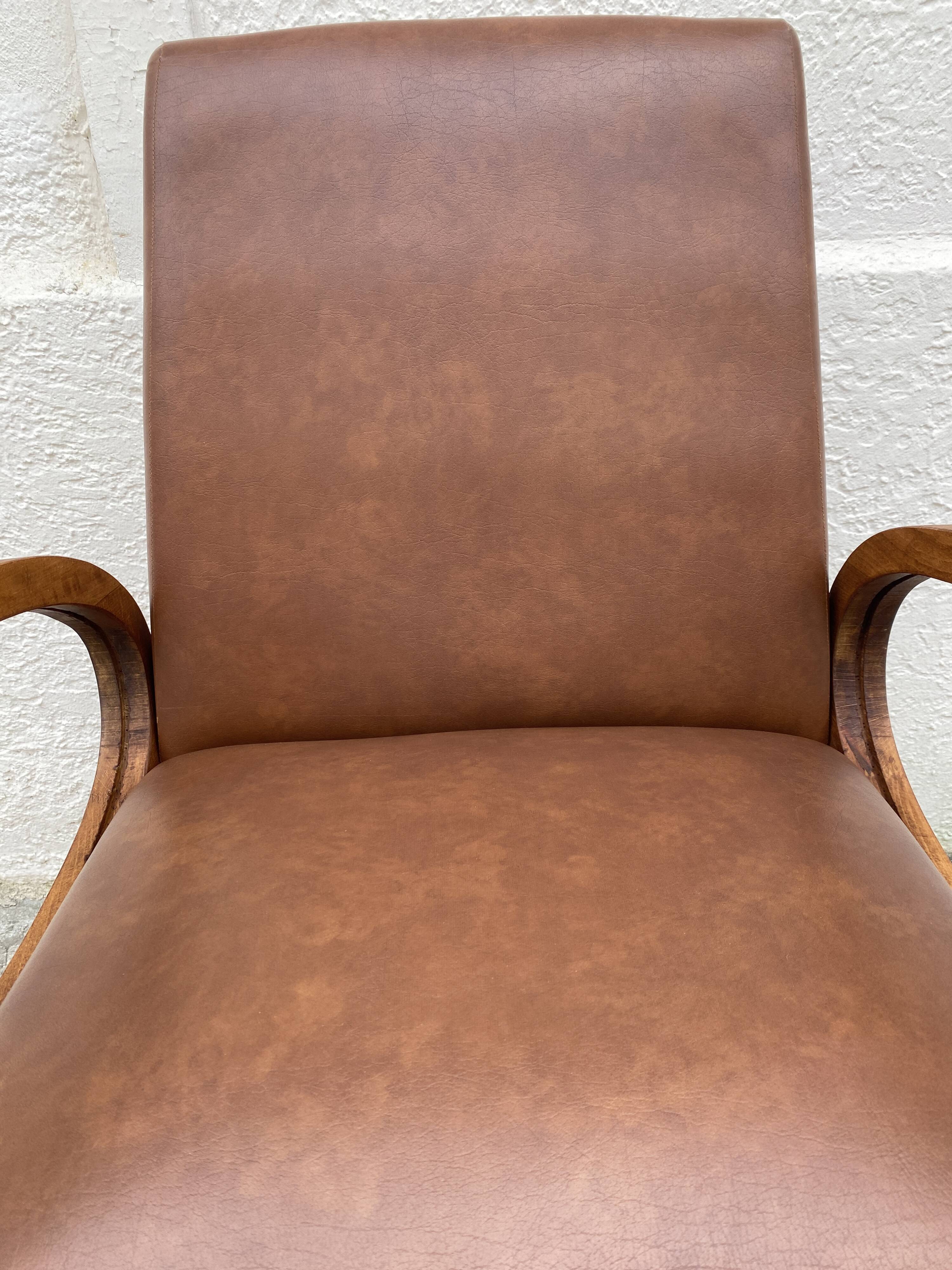 Mid-Century Scandinavian vintage retro armchair with oval armrests.