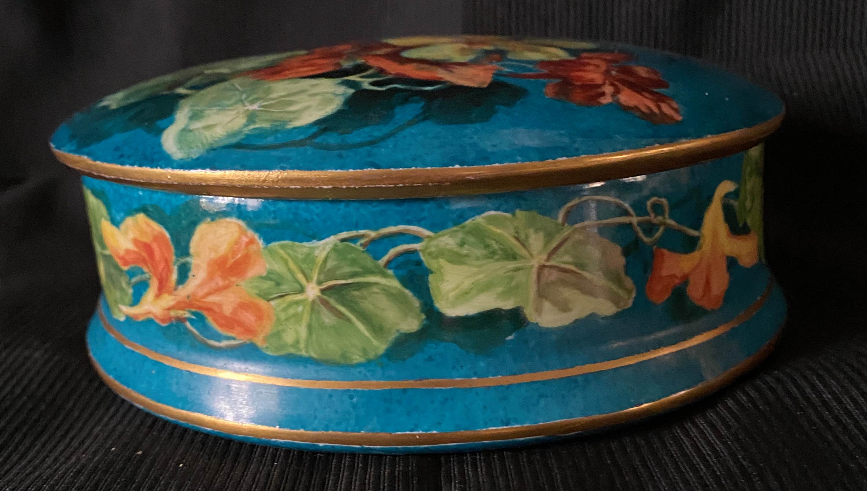 Antique porcelain candy box with floral motifs