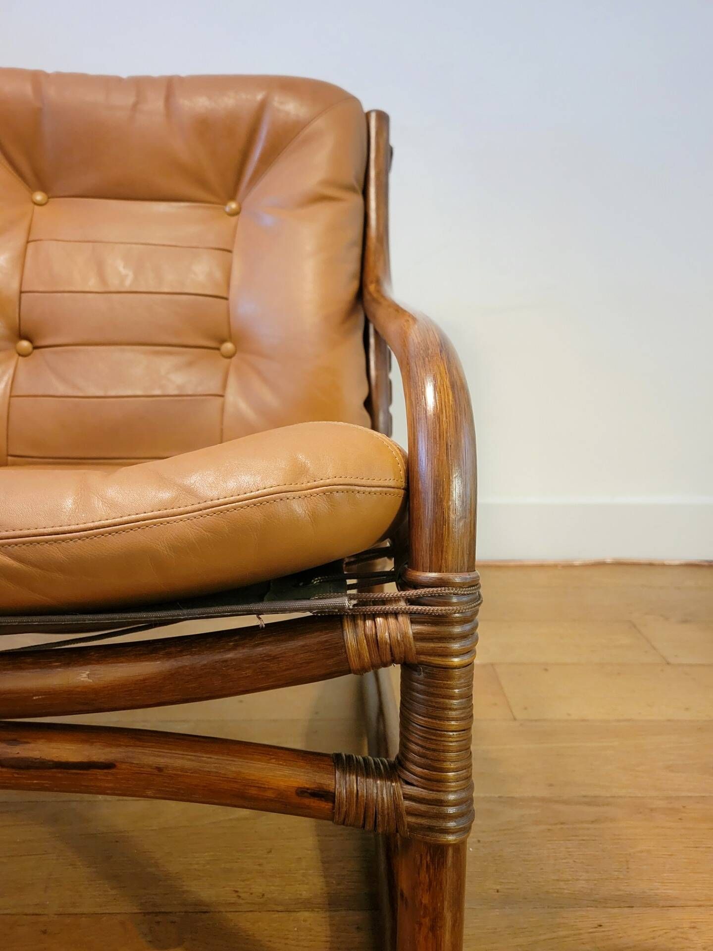 Vintage rattan armchair with leather cushions from 1970