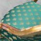 Pair of Louis XV style gilded armchairs with vintage green fabric