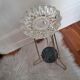Crystal ashtray on brass tripod stand