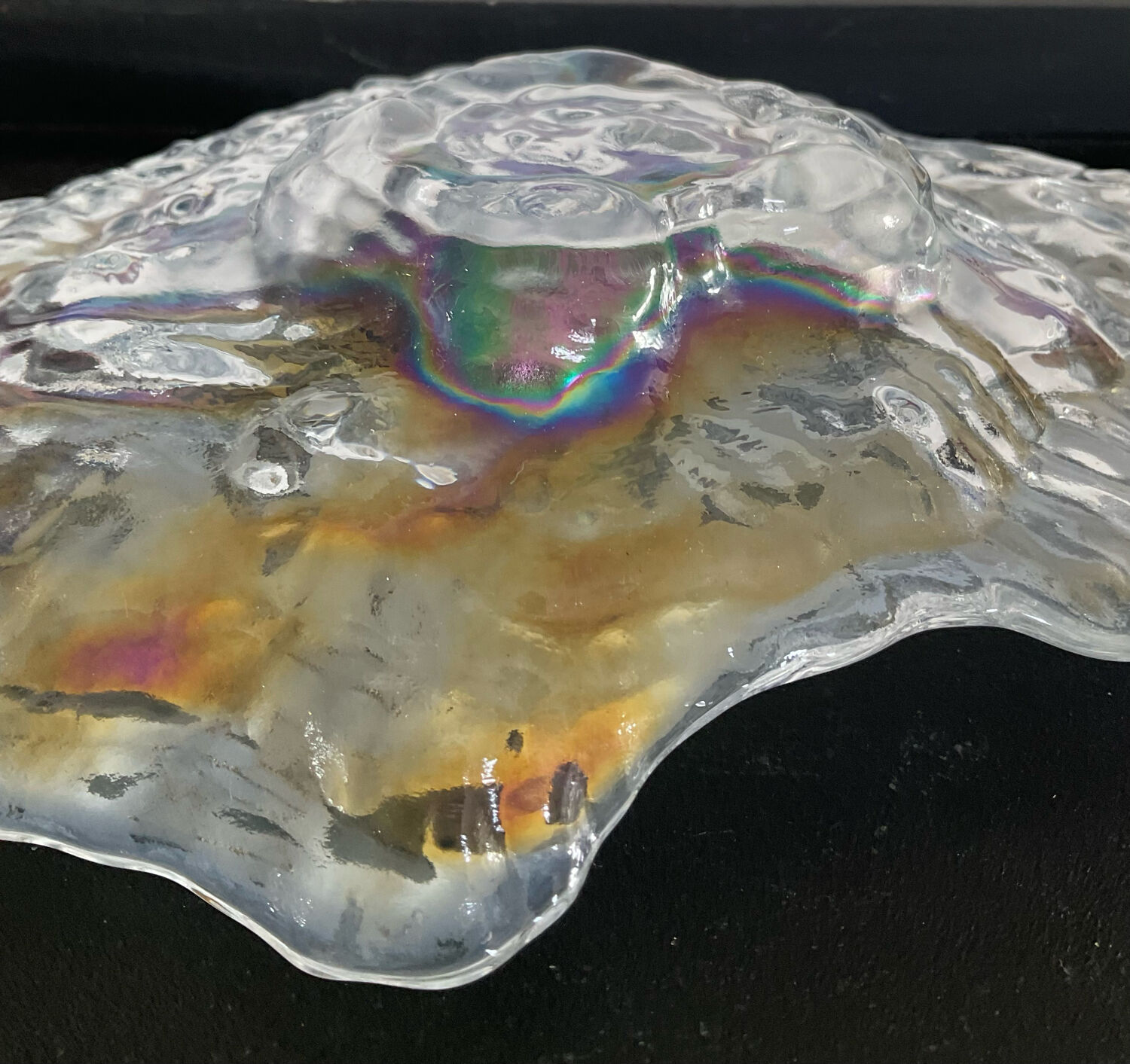 Empty vintage pocket in iridescent glass