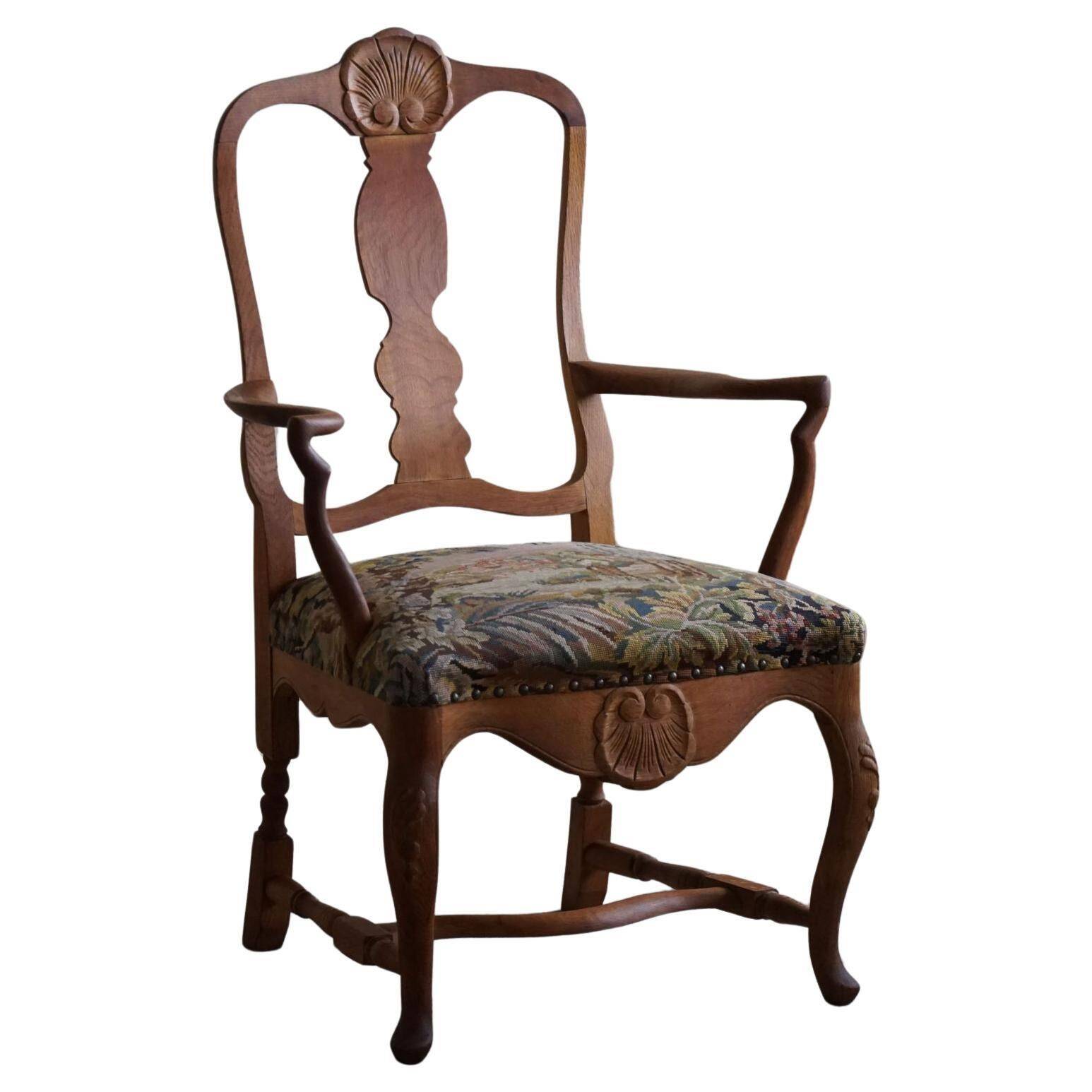 Classic Baroque style armchair in oak, made by a Danish cabinetmaker, 1930s.